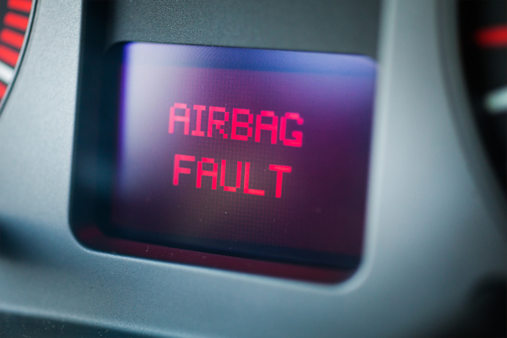 Vehicle warning light reads "Airbag Fault"