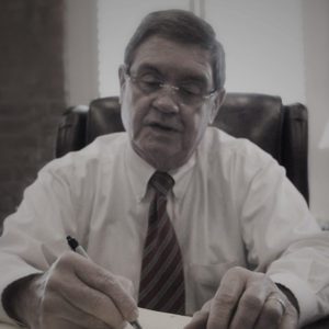 Beasley Allen founder Jere Beasley sitting at his desk
