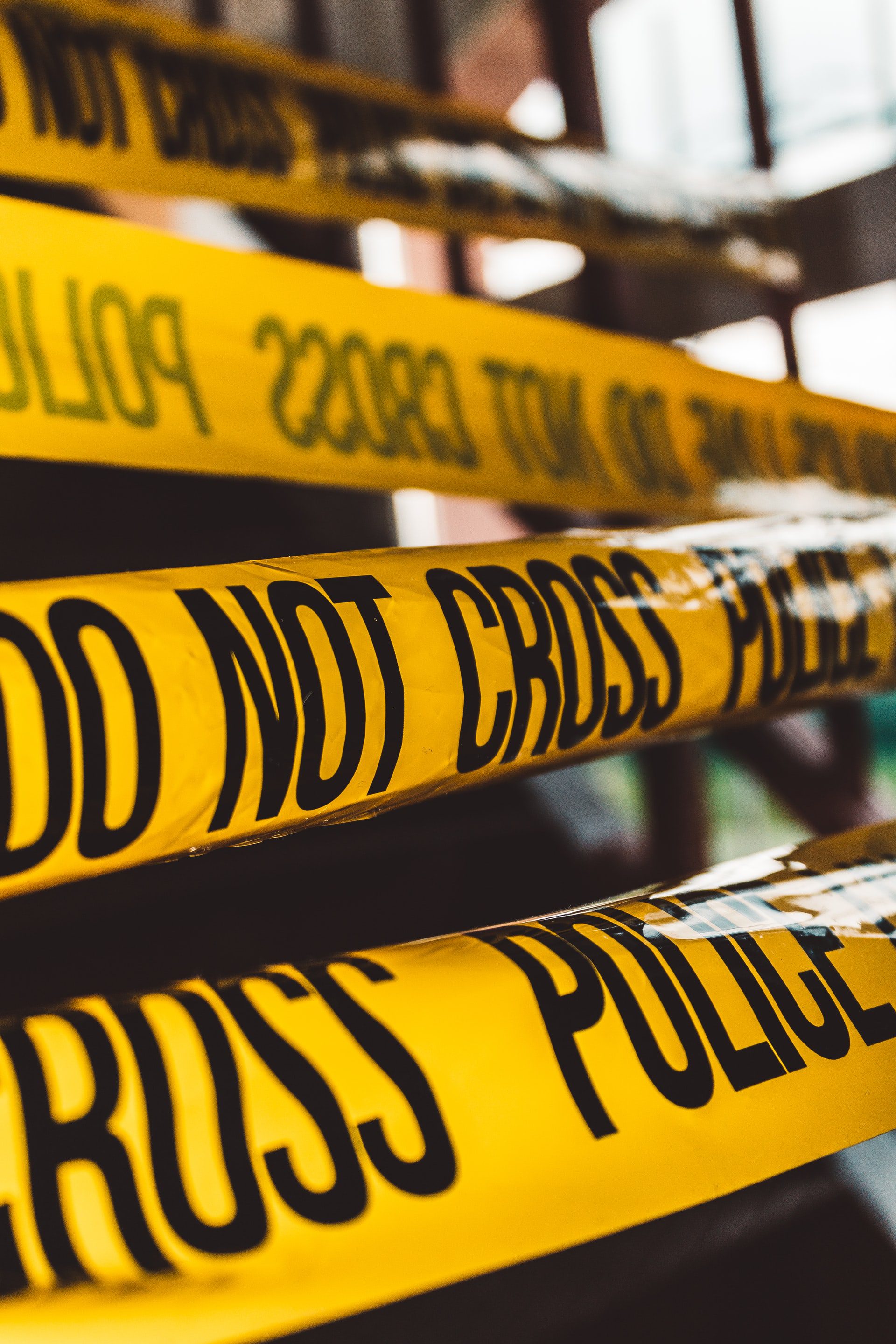 Close up of police tape reading "Do not cross"
