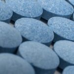 Close up of many small round blue pills