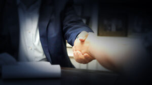 Consumer Protection lawyer shakes hands with a client