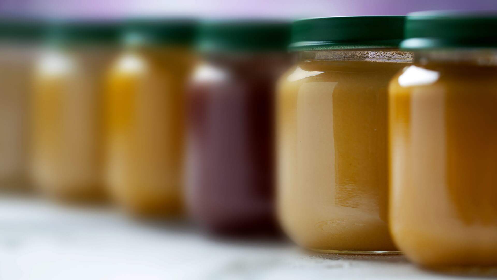 Jars of baby food in a row