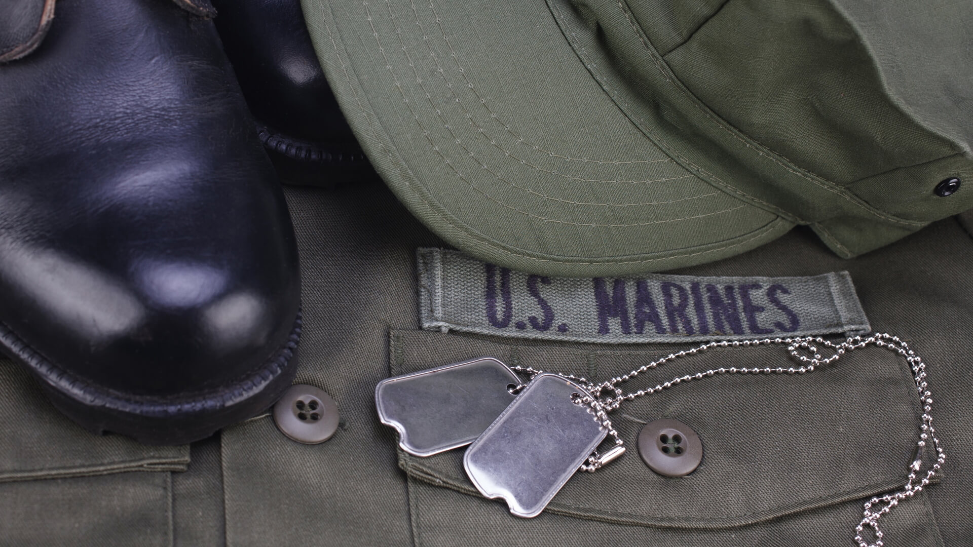 Folded Marine Uniform, boots and dogtags