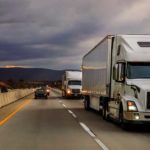 Commercial Trucks driving on the the highway