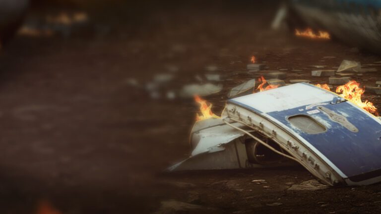 Fiery debris from plane crash in a field