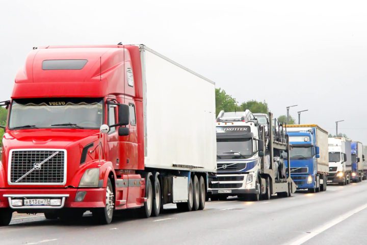 Commercial Trucks driving on the the highway representing a truck accident lawsuit case settlement