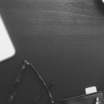 A lawyer's desk with a laptop and gavel