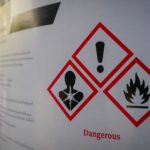 Toxic Exposure: Close up of a warning label on chemical barrel