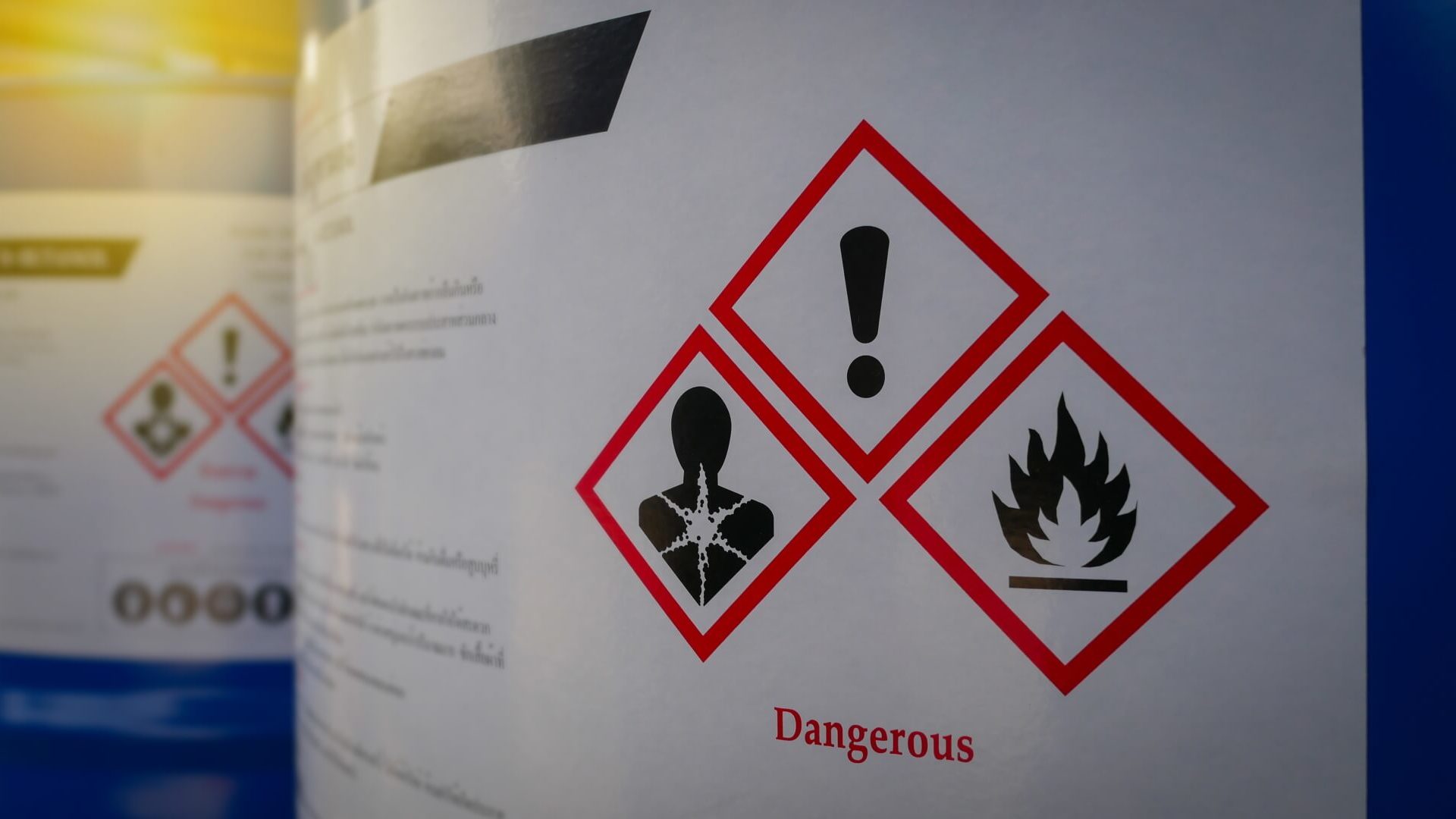 Toxic Exposure: Close up of a warning label on chemical barrel
