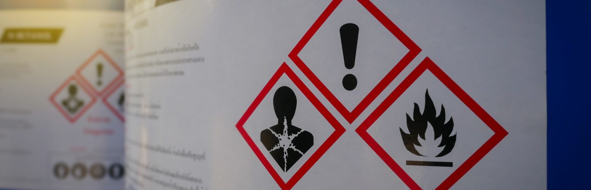 Toxic Exposure: Close up of a warning label on chemical barrel